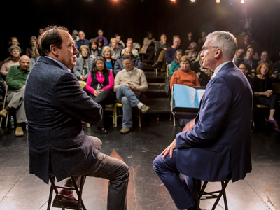 Photo of two speakers at Thrive and audience in front of them