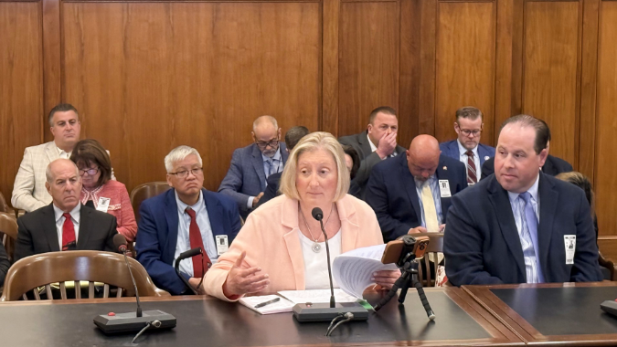 Adam testifying