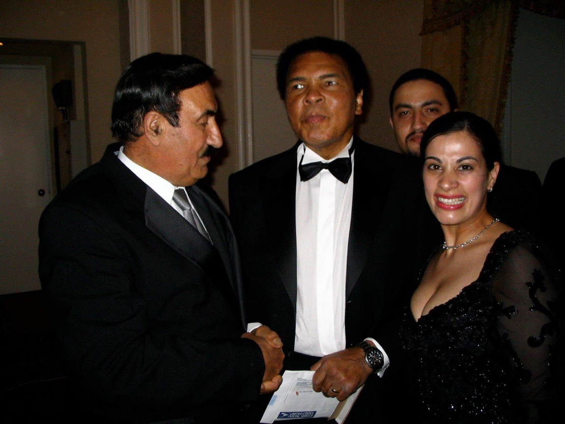Maysoon Zayhid, right, with her dad, left, and Muhammed Ali, center